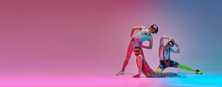 Flexible men in colorful, vintage sportswear stretching against gradient blue pink studio background...