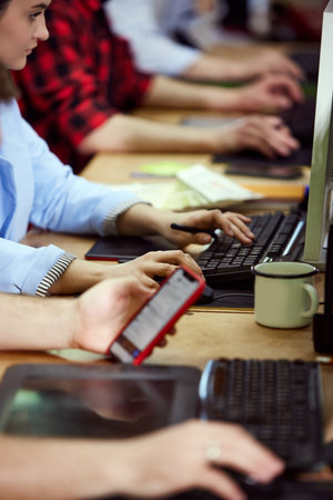 Close-up image of hands, graphic designer, retoucher working with photos, using graphic tablet and stylus, editingの写真素材