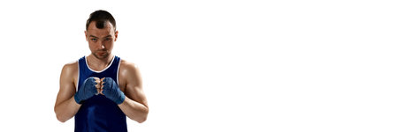 Portrait of young muscular, professional boxer posing in uniform isolated over white background. Bannerの写真素材