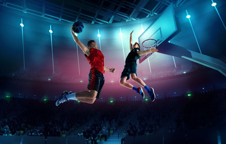 Dynamic image of young men, professional basketball players in motion, in a jump with ball under...