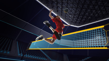 Bottom view, dynamic image of young man, volleyball player in motion, during game hitting ball. 3D arena, courtの写真素材