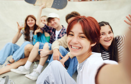 Friends, teens taking selfie, meeting on skate park for skateboarding and active leisure time. Happinessの写真素材