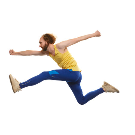 Young man in sportswear running in a jump isolated on white background. Overcoming difficulties....