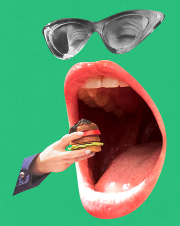 Woman with wide open giant mouth eating small burger over green background. Street food. Contemporary art collage.の写真素材