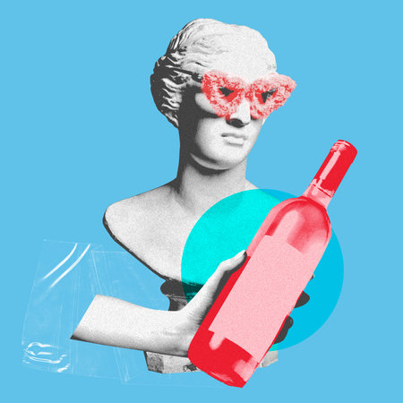 Female antique statue bust in fluffy sunglasses with hand holing bottle of wine over blue background. Contemporary art collage.の写真素材