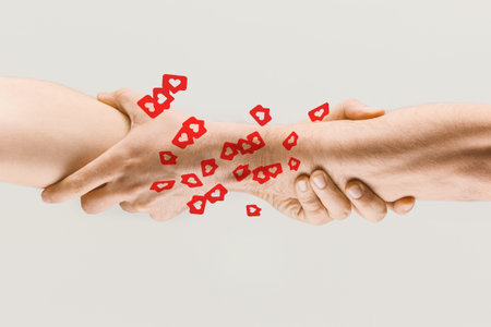Human hands holding over many social media likes. Online popularity, influence, support, friendship