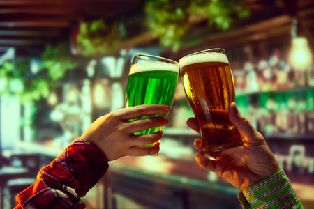 Sports event viewing party advertisement with featured drinks. Human hands cling lager and green beer glasses over bar background. Sport match translationの写真素材