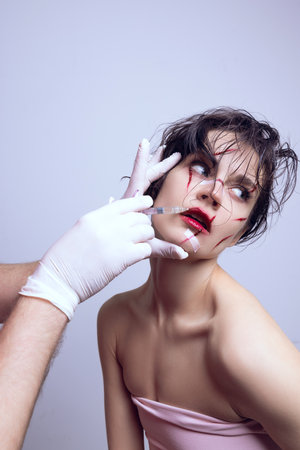 Lip augmentation. Young woman doing facial beauty treatment, visiting cosmetologist to make lips...