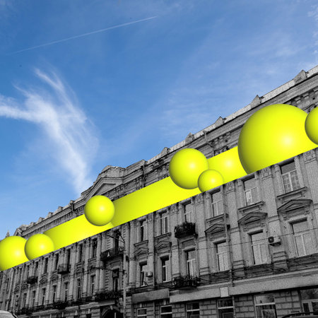 Monochrome old style building with oversized yellow spherical elements against blue sky background. Contemporary art collage.の写真素材
