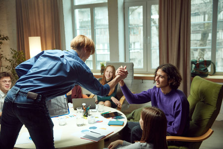 Good job. Motivated young people, students meeting in library for common work on project. Brainstorming.の写真素材