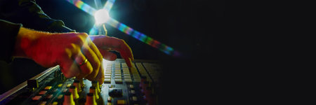 Electronic music, party and night club entertainment. Close-up of dj mixer, man adjusting sounds and...