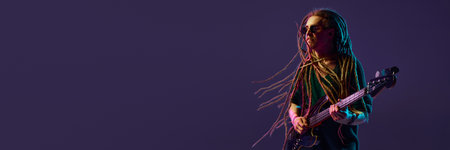 Soulful musician with dreadlocks pouring his heart out through his electric guitar melodies against...