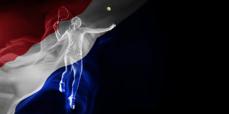 Dynamic image of young woman, tennis payer in motion, hitting all with racket on black background with flag of France elementの写真素材