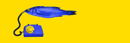 Blue fish with retro telephone on bright yellow background. Contemporary art collage....