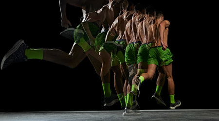 Inspiring image, muscular man is captured in full motion, running against black background with...