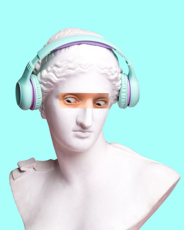 Antique statue bust with human eye photo elements expressing shock, wearing headphones on blue background. Modern design. Contemporary colorful art collage.の写真素材
