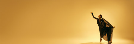 Flow and grace of dancer movements. Elegant artistic woman, ballet dancer making creative performance against sand color backgroundの写真素材