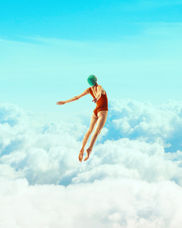 Woman in red swimsuit and cap diving against fluffy clouds and blue sky background. Freedom. Contemporary art collage.の写真素材