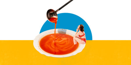 Elegant young woman in red polka-dot swimsuit sitting inside large bowl of tomato soup. Relaxing. Contemporary art collage.の写真素材