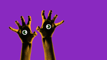 Two outstretched hands with eyes in their palms, against purple background, creating creepy and mysterious vibe. Contemporary art collage.の写真素材