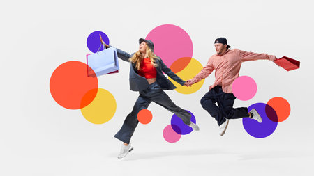 Stylish man and woman jumping mid-air, filled with excitement, holding shopping bags against white background with colorful abstract elements. Creative design.の写真素材