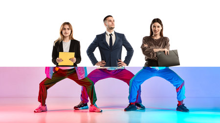 Business meets breakdance. Creative collage. Three business professionals from the waist up, with...