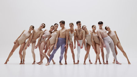 Modern ballet ensemble in neutral tones. Group of ballet dancer making creative performanceの写真素材