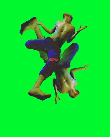 Striking abstract composition of male dancer captured mid-motion, forming dynamic and fluid shapes.