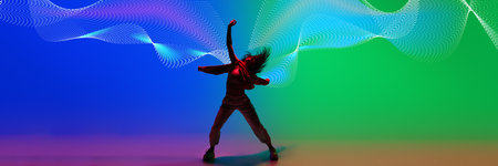 Creative design. Dynamic image of young woman in casual clothes dancing hip hop on gradient blue...
