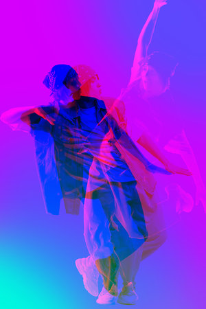 Female dancer in sport style clothes, dancing hip hop, with vibrant purple, pink, and blue overlay effects.の写真素材