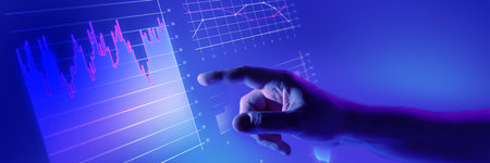Hand interacting with glowing digital financial charts in blue futuristic interface. Data...