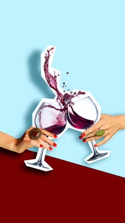 Two female hands with luxurious rings clinking cut-out glasses filled with red wine on minimalist blue and red background.の写真素材