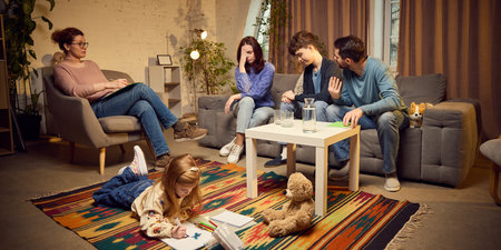 Family of four, including parents, teen boy and school-aged girl visiting psychologist, maintaining healthy surrounding for kids growth and communicationの写真素材