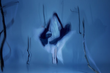 Floating between light and shadow. Two graceful ballerinas in light and dark veil moving in endless...