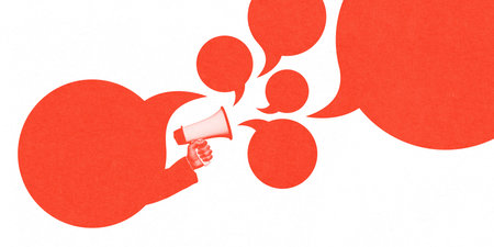 Oversized speech bubbles pour from megaphone, representing mass communication, influence, and spread of information in dialogue.の写真素材