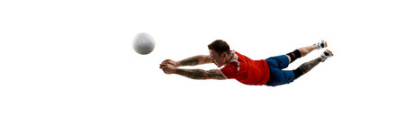 Dynamic image of young guy in red jersey and blue short playing volleyball with focus against white background.の写真素材