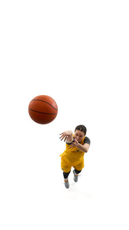 Top view dynamic image of woman, basketball player scoring goal, throwing ball in basket isolated on...