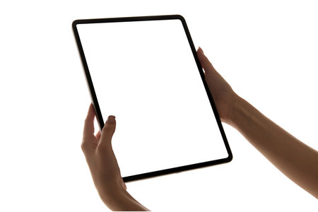 Hands holding tablet with blank white screen against white background. Mockup