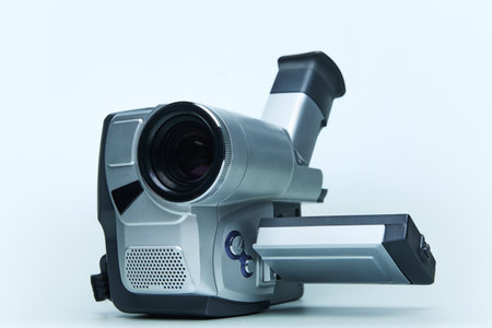Angled view of retro video camera with extended screen, emphasizing lens and control design from early digital recording era.の写真素材