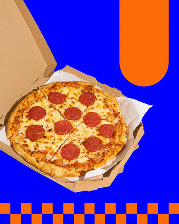 Pepperoni pizza in open cardboard box on bold graphic blue background with orange checkered accents.の写真素材