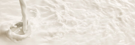 Milk pours into creamy surface with visible swirl and dynamic liquid texture.の写真素材