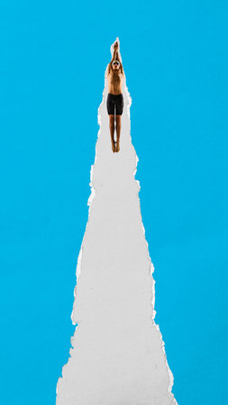 Focused swimmer jumps into torn paper space with streamlined arms and goggles on blue background. Contemporary collage. Concept of sport, game, competition, performance, strengthの写真素材