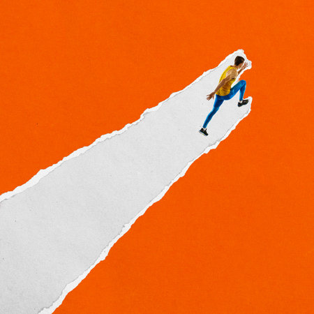 Male runner in yellow top and blue tights runs upward on diagonal torn paper stripe against orange background. Textured scrap collageの写真素材