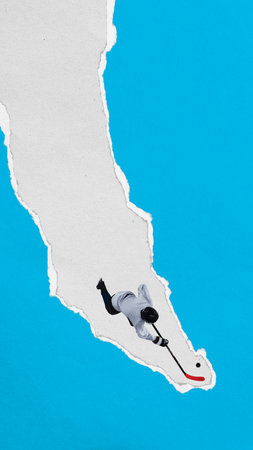 Male hockey player slides with puck through vertical torn paper stripe against blue background. Textured collage style.の写真素材