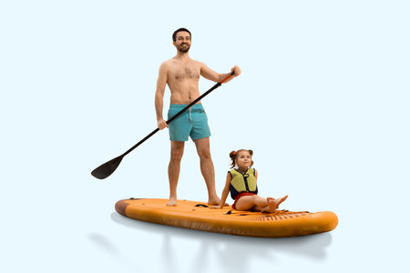 Proud man, father paddling on sup board with his child daughter sitting calmly in life vest on board isolated on neutral studio backgroundの写真素材