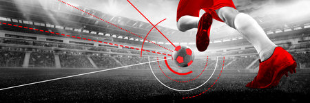 Soccer player jumps mid-air to kick ball with red cleats on stadium field with red interface lines. Conceptual art collage. Bannerの写真素材