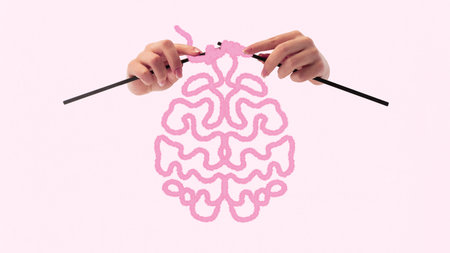 Soft Power. Gentle hands knit soft pink brain from yarn, showing care, empathy and how emotional strength forms in silence. Conceptual art collage.の写真素材