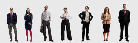 Group of business people in stylish office outfits on white background. Concept of teamwork, diversity, business style.の写真素材