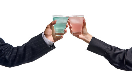 Clarity and chill. Two hands holding clear drinks with ice and distinct hues. Celebration, success.