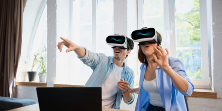 Couple immersed in virtual reality experience with headsets exploring digital world together